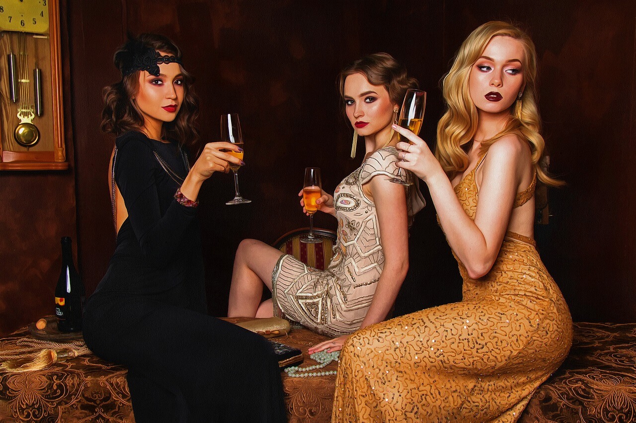 a group of women holding champagne glasses