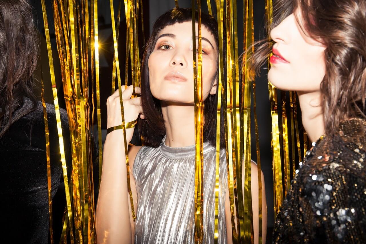 One person giving an envelope to another.